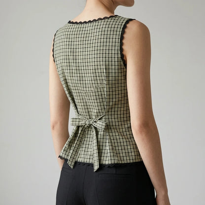 Model wearing apricot-boat-neck-plaid-tank-top with close focus on the product