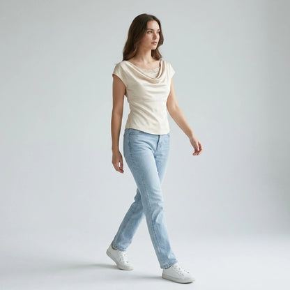 Second natural lifestyle image of a model wearing apricot-cowl-neck-lace-tee