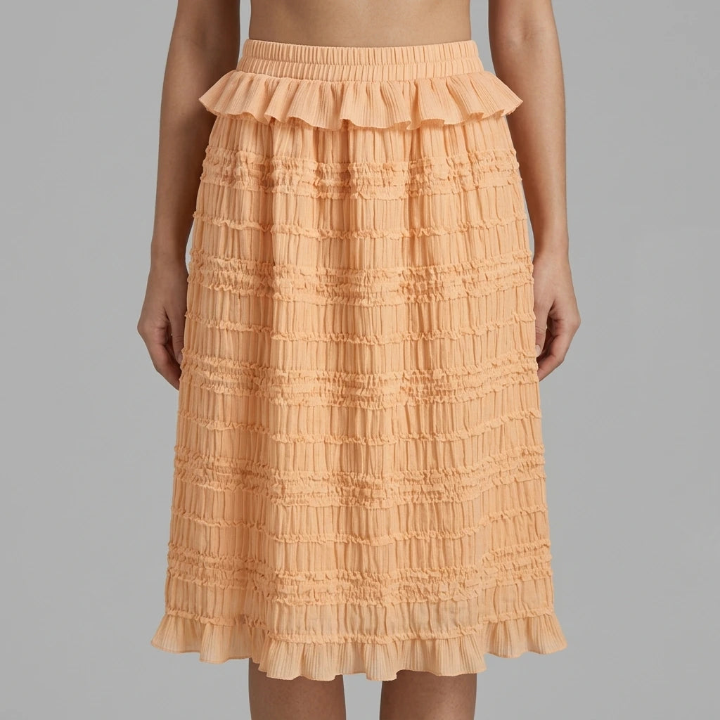 Model wearing apricot-elastic-waist-shirred-midi-skirt with close focus on the product