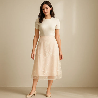 Natural lifestyle image of a model wearing Apricot Floral Embroidered Mesh Midi Skirt High Waist A-Line Elegant