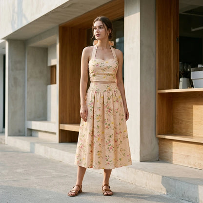 Natural lifestyle image of a model wearing Apricot Floral Halter Two-Piece Skirt Set