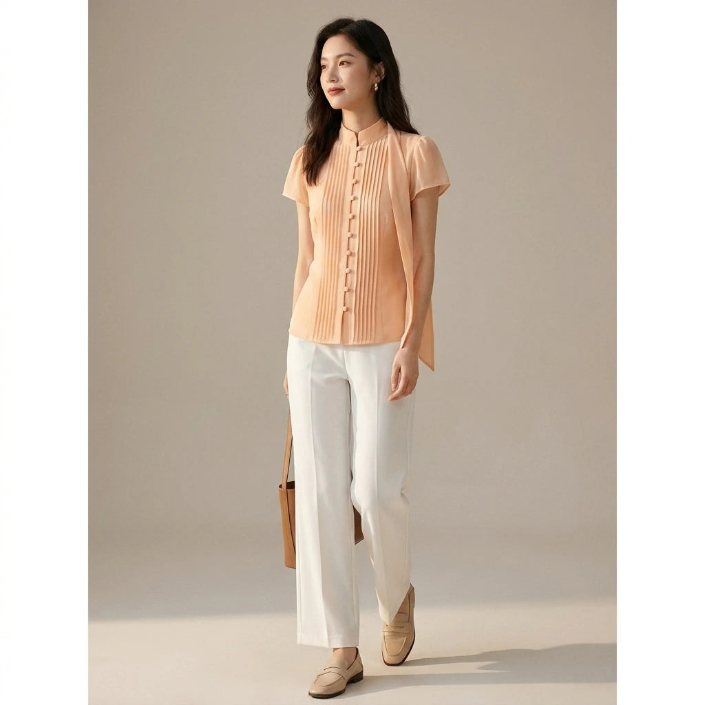 Natural lifestyle image of a model wearing apricot-mock-neck-button-chiffon-blouse