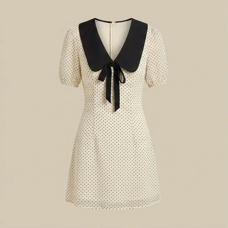 Front product-only image of apricot-polka-dot-contrasting-mini-dress