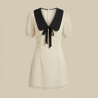 Front product-only image of apricot-polka-dot-contrasting-mini-dress