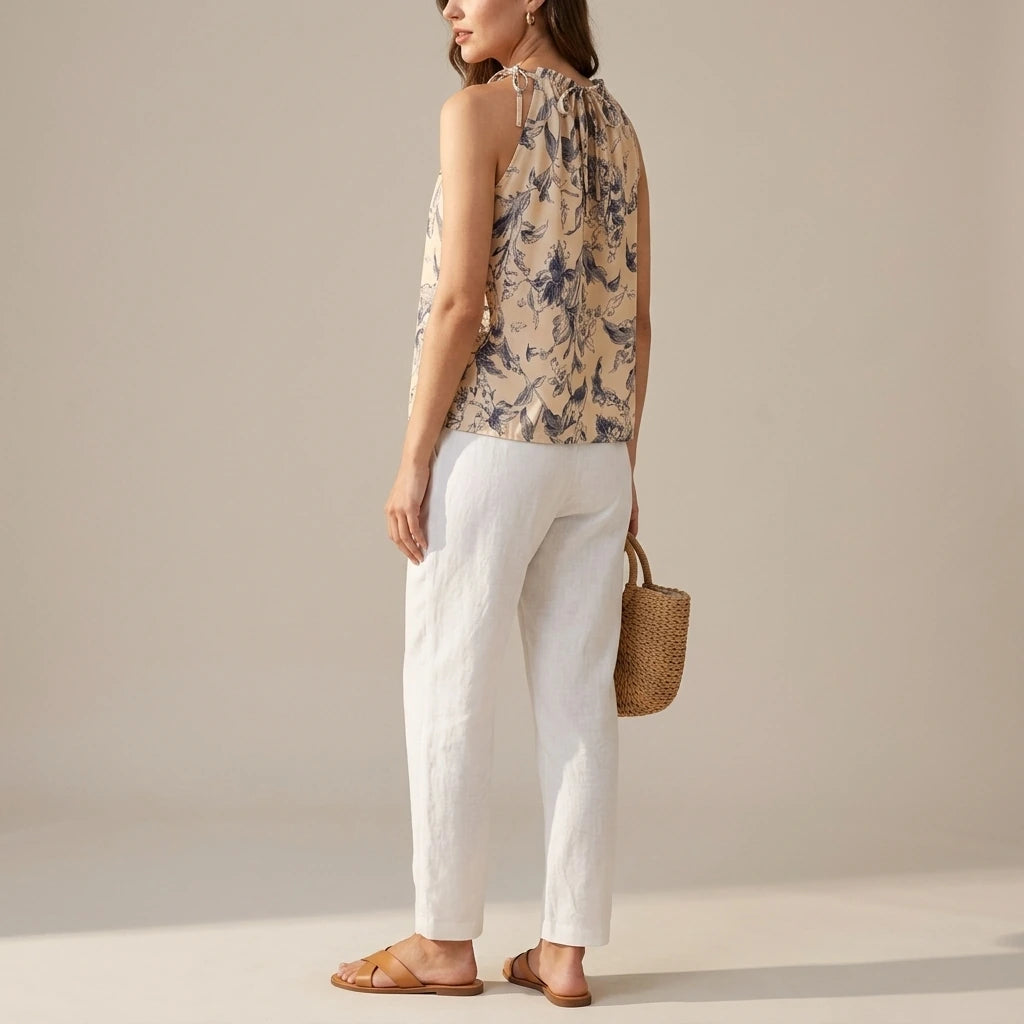 Natural lifestyle image of a model wearing apricot-ruffled-floral-tank-top