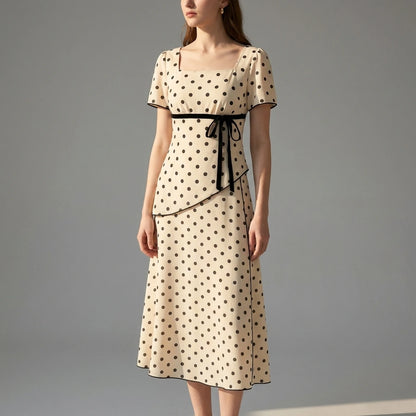 Natural lifestyle image of a model wearing apricot-square-neck-polka-dot-two-piece-set