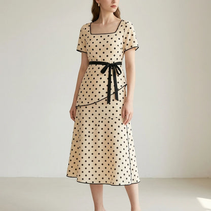 Second natural lifestyle image of a model wearing apricot-square-neck-polka-dot-two-piece-set