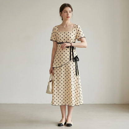 Third natural lifestyle image of a model wearing apricot-square-neck-polka-dot-two-piece-set