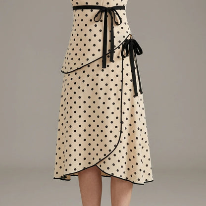 Model wearing apricot-square-neck-polka-dot-two-piece-set with close focus on the product