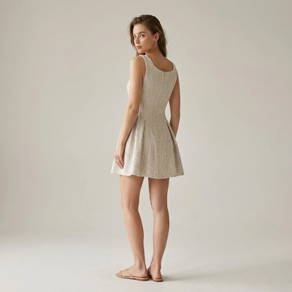 Second natural lifestyle image of a model wearing Apricot Textured Sleeveless Mini Dress