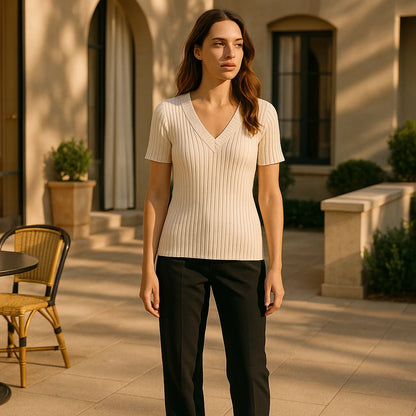 Natural lifestyle image of a model wearing Apricot V Neck Short Sleeve Tee Top Viscose Textured Refined Summer