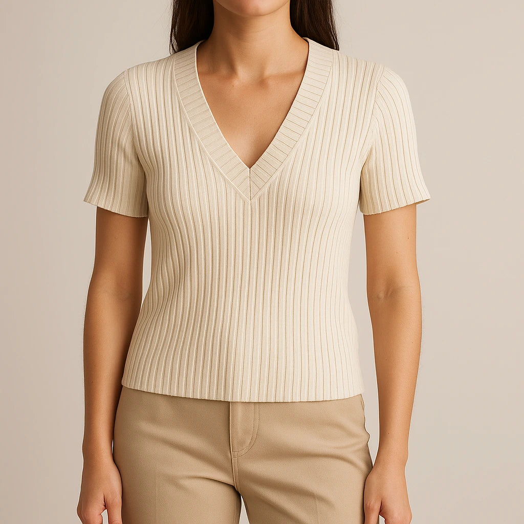 Model wearing Apricot V Neck Short Sleeve Tee Top Viscose Textured Refined Summer with close focus on the product