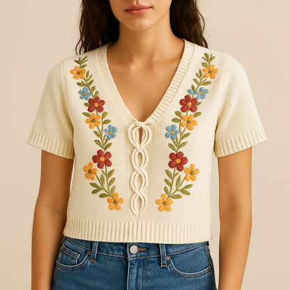 Model wearing Apricot Floral Embroidery Sweater Top V Neck Short Sleeve Summer with close focus on the product
