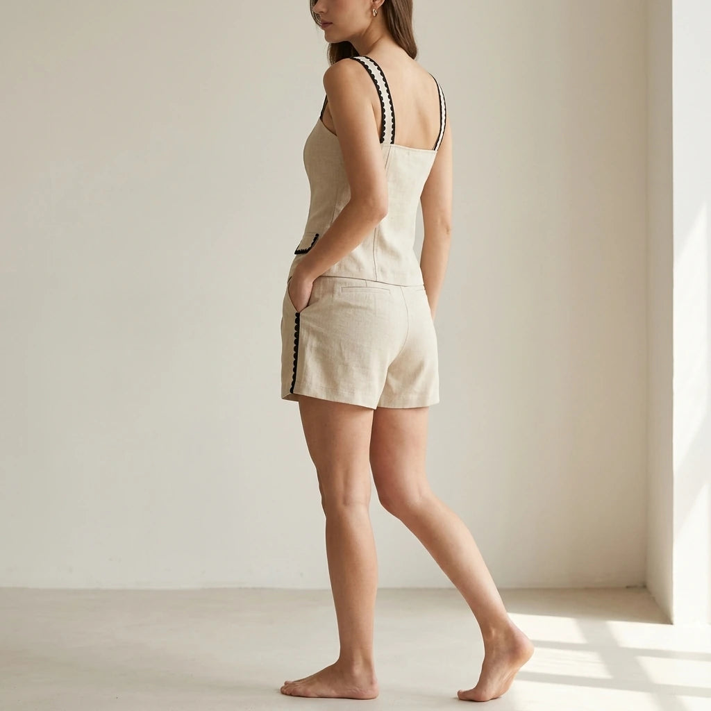 Second natural lifestyle image of a model wearing beige-contrasting-button-shorts