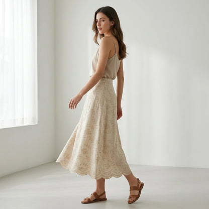 Second natural lifestyle image of a model wearing beige-embroidery-midi-skirt