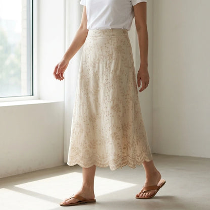 Third natural lifestyle image of a model wearing beige-embroidery-midi-skirt