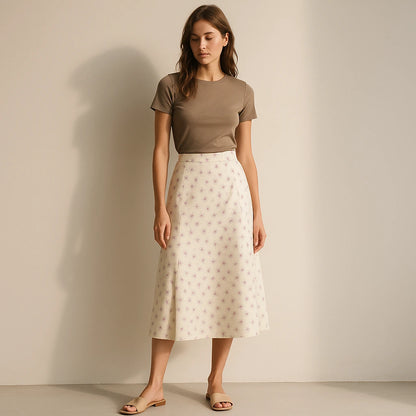 Natural lifestyle image of a model wearing Beige Floral Slit Midi Skirt High Waist A-Line Elegant