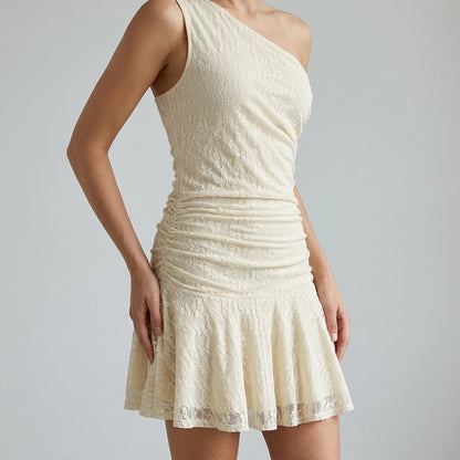 Model wearing beige-lace-one-shoulder-mini-dress with close focus on the product