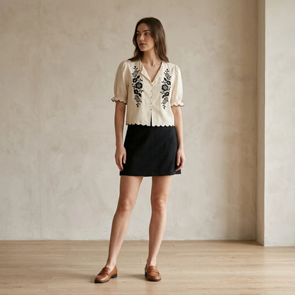 Natural lifestyle image of a model wearing Beige Puffed Sleeve Embroidery Contrasting Blouse