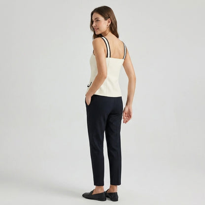 Second natural lifestyle image of a model wearing beige-square-neck-contrasting-cami-top