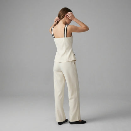 Third natural lifestyle image of a model wearing beige-square-neck-contrasting-cami-top