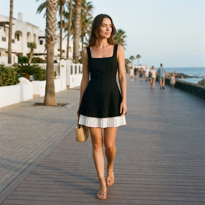 Natural lifestyle image of a model wearing Black Contrasting A-Line Slip Mini Dress
