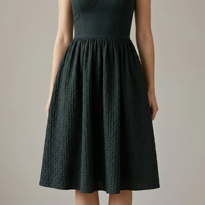 Model wearing Black Sweetheart Neck Slip Midi Dress with close focus on the product
