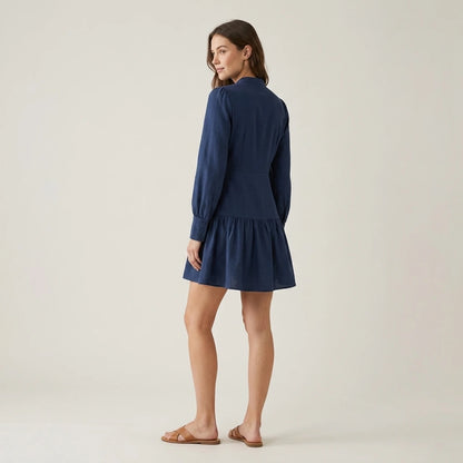 Third natural lifestyle image of a model wearing blue-a-line-pleated-mini-dress