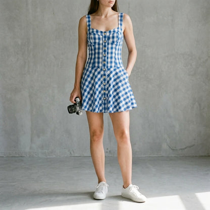Third natural lifestyle image of a model wearing Blue Plaid Slip Mini Dress