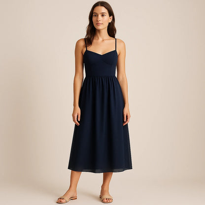 Third natural lifestyle image of a model wearing Blue Shirred Slip Maxi Dress Flowy High Waist Sleeveless Mesh Occasion Summer