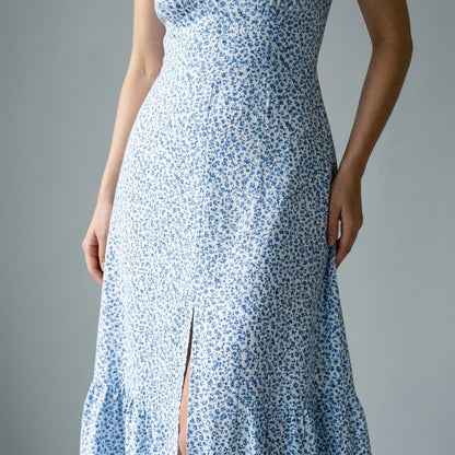 Model wearing blue-v-neck-tie-floral-maxi-dress with close focus on the product