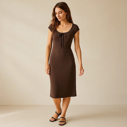 Natural lifestyle image of a model wearing Brown Boat Neck Cap Sleeve Midi Dress Ruched Sheath Knit