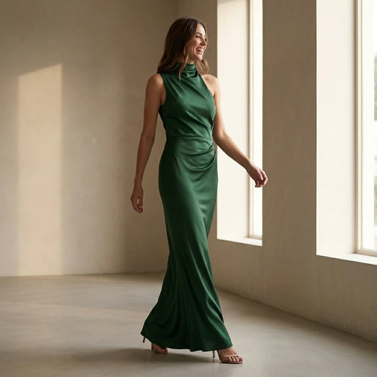 Natural lifestyle image of a model wearing green-one-shoulder-tunic-maxi-dress