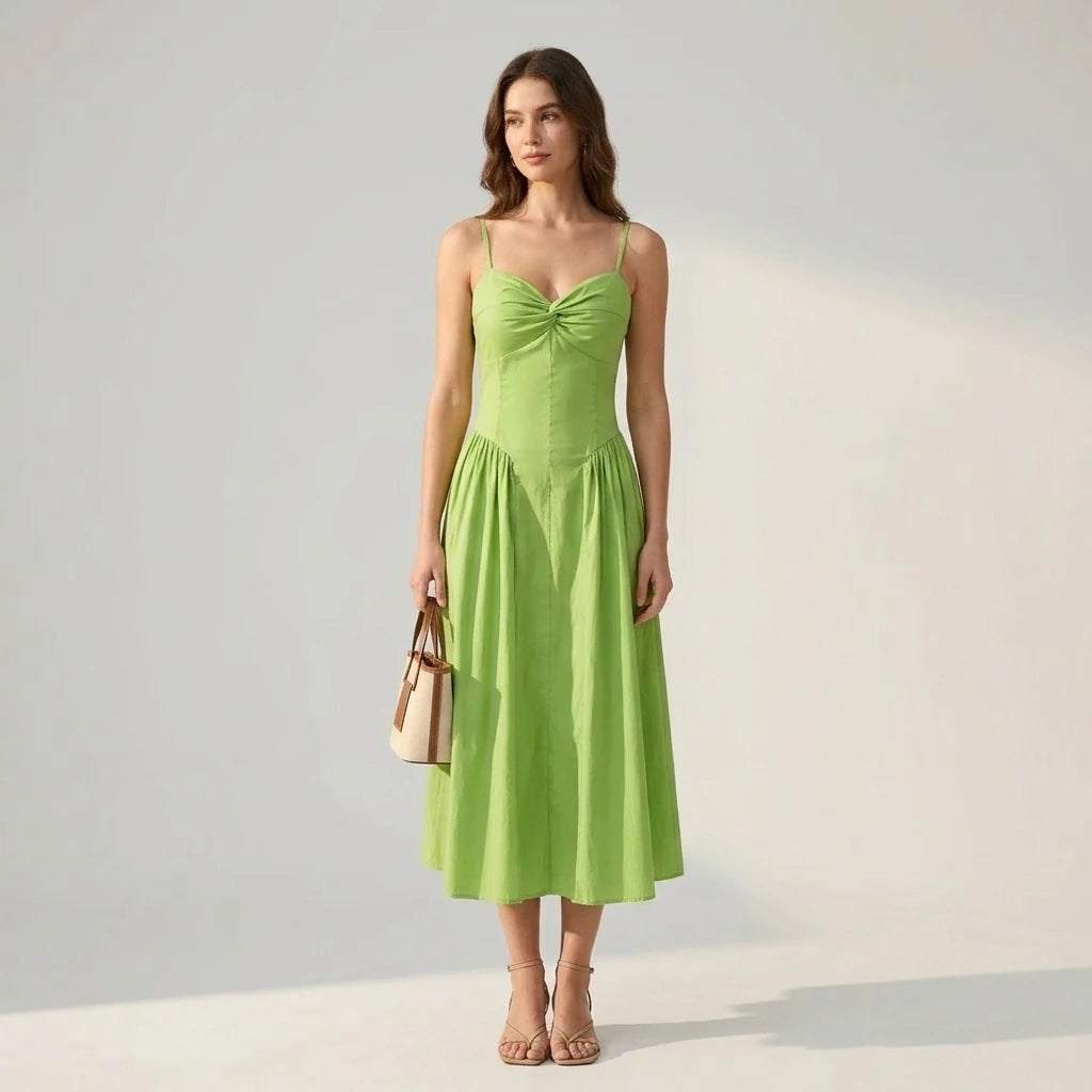 Natural lifestyle image of a model wearing green-sweetheart-neck-slip-midi-dress
