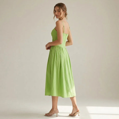 Second natural lifestyle image of a model wearing green-sweetheart-neck-slip-midi-dress