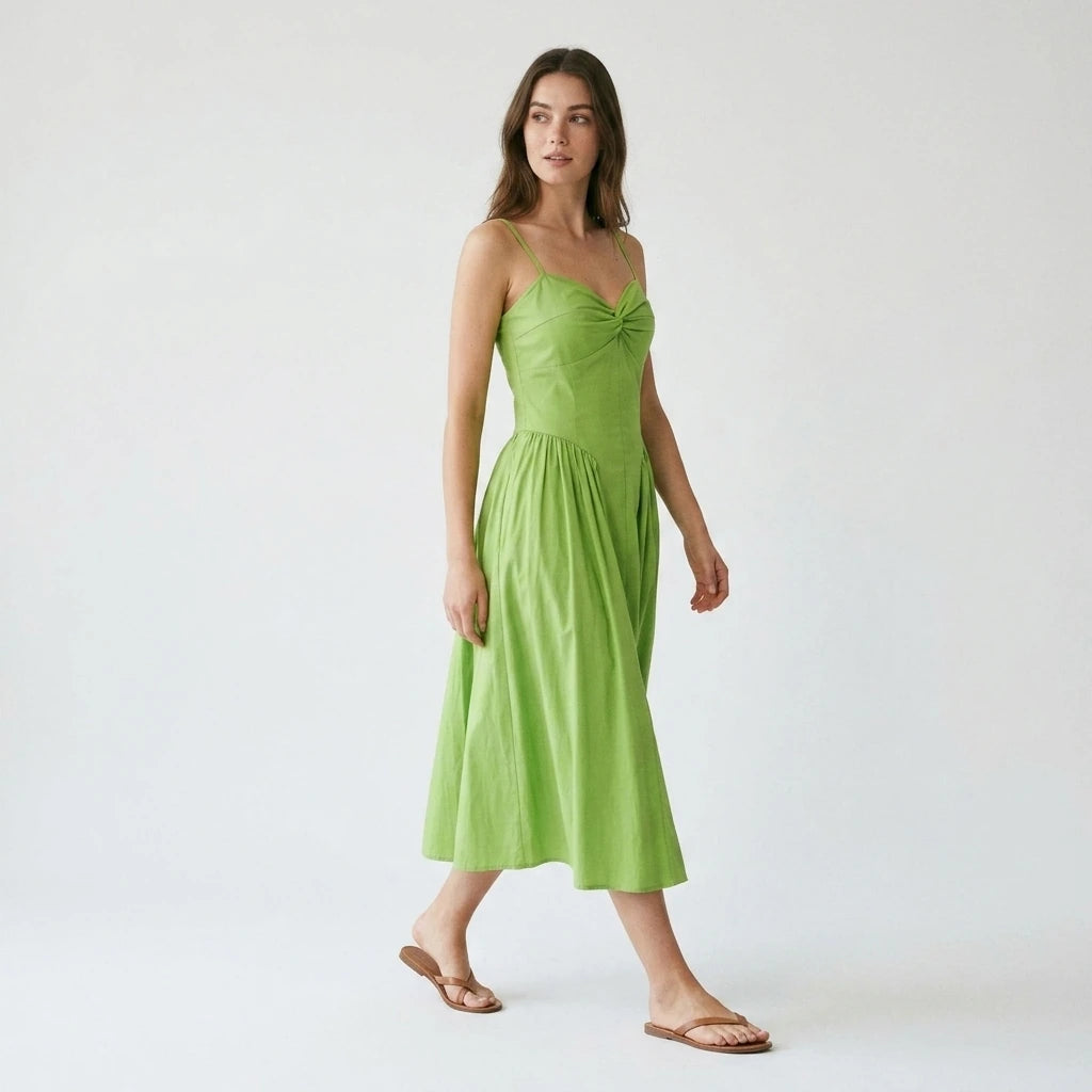 Third natural lifestyle image of a model wearing green-sweetheart-neck-slip-midi-dress