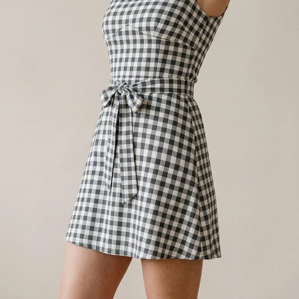 Model wearing Grey Boat Neck Plaid Mini Dress with close focus on the product