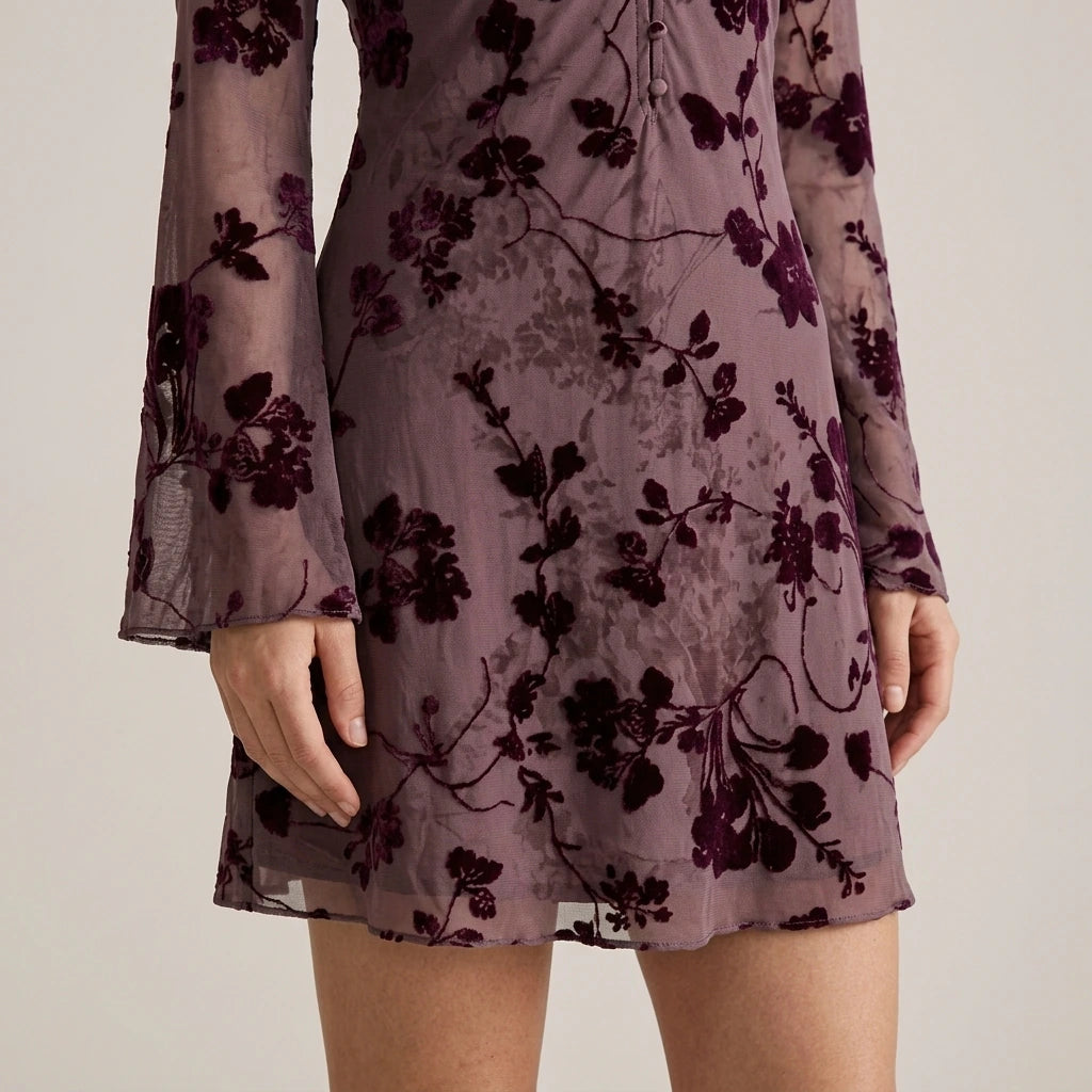 Model wearing purple-v-neck-floral-mini-dress with close focus on the product