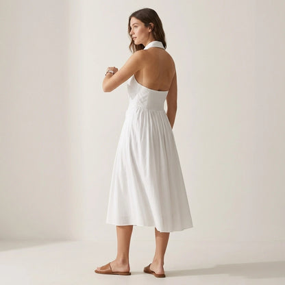 Third natural lifestyle image of a model wearing The White Collared Twist Backless Midi Dress