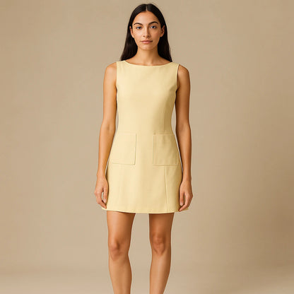 Third natural lifestyle image of a model wearing Yellow Sheath Cut Out Mini Dress Pockets Boat Neck Sleeveless Workwear Summer