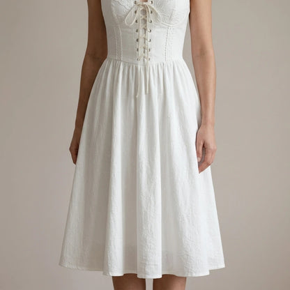 Model wearing white-embroidery-a-line-halter-midi-dress with close focus on the product