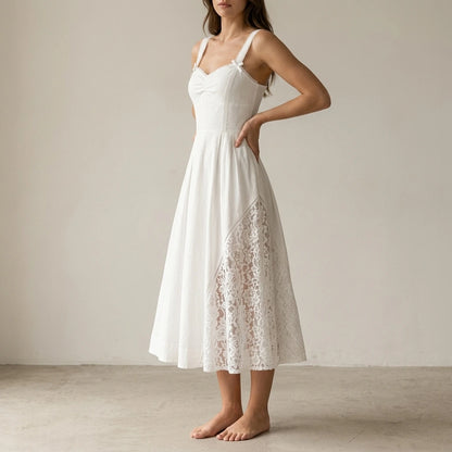 Second natural lifestyle image of a model wearing White Lace Splicing Shirred Midi Dress