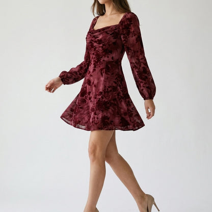 Second natural lifestyle image of a model wearing wine-red-cowl-neck-floral-mini-dress