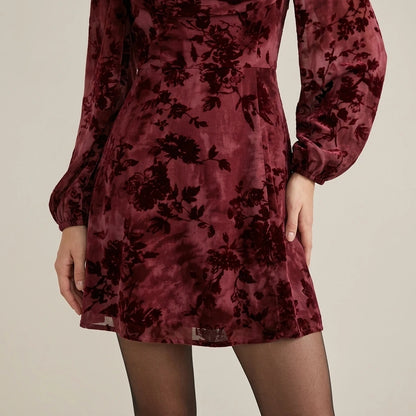 Model wearing wine-red-cowl-neck-floral-mini-dress with close focus on the product