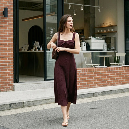 Third natural lifestyle image of a model wearing wine-red-slip-midi-dress